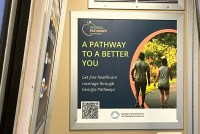A photo of a train advertisement that reads, "A pathway to a better you. Get free healthcare coverage through Georgia Pathways."