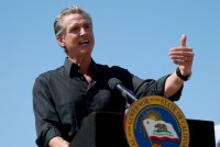 A photo of Governor Gavin Newsom speaking at a podium with the governor's seal on it.