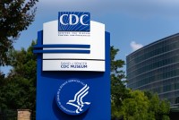 A blue and silver sign outside the Centers for Disease Control and Prevention (CDC) headquarters in Atlanta, Georgia, US.